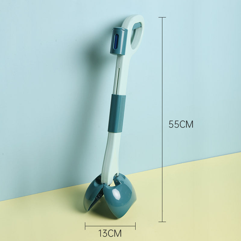 Dog cleaning feces shovel with an ergonomic handle, shown in use outdoors for hygienic and mess-free waste removal.