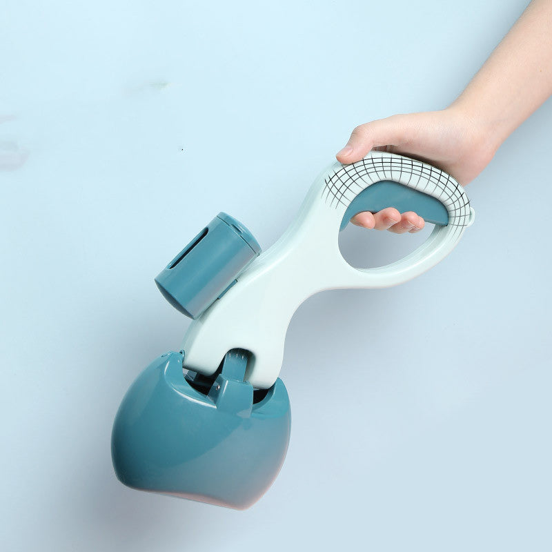 Dog cleaning feces shovel with an ergonomic handle, shown in use outdoors for hygienic and mess-free waste removal.