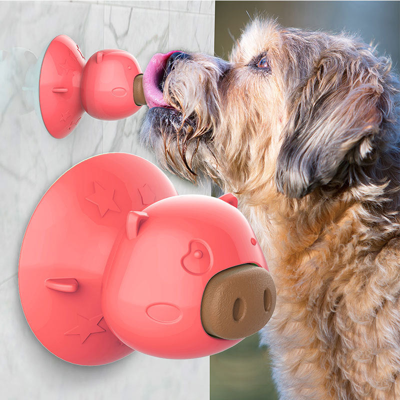 Interactive dog bathing toy attached to a bathroom wall with a dog enjoying its treat, promoting a fun and relaxed bath experience.