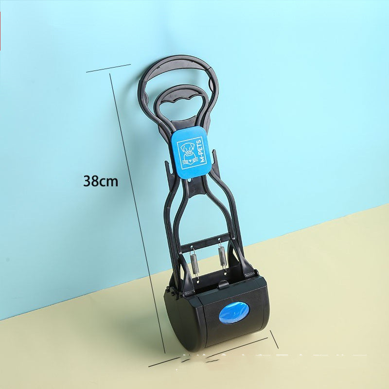 Dog cleaning feces shovel with an ergonomic handle, shown in use outdoors for hygienic and mess-free waste removal.